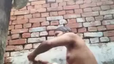 Young desi woman sets the camera on and starts her XXX shower show