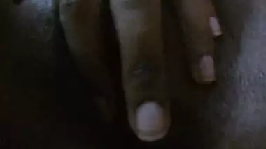 Indian girl with dark skin spreads XXX pussy in front of the camera