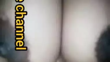 Naughty Desi woman squeezes tits to lick nipples in the porn video