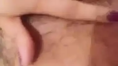 Indian girl nude MMS of a girl fingering her hairy pussy