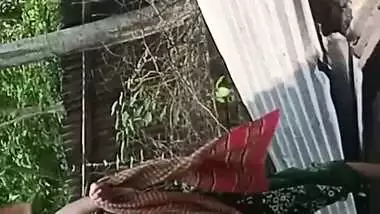 Village neighbor girl outdoor bath caught through hole
