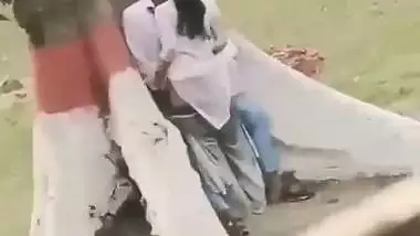College couple enjoys outdoor sex below a big tree