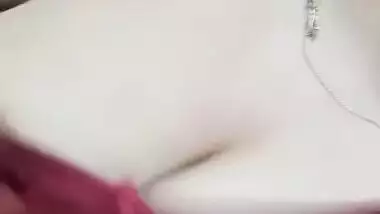 Sexy cute girl shows her big round boobs