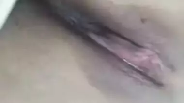 Risque Indian babe takes breasts and pussy out in a short porn video